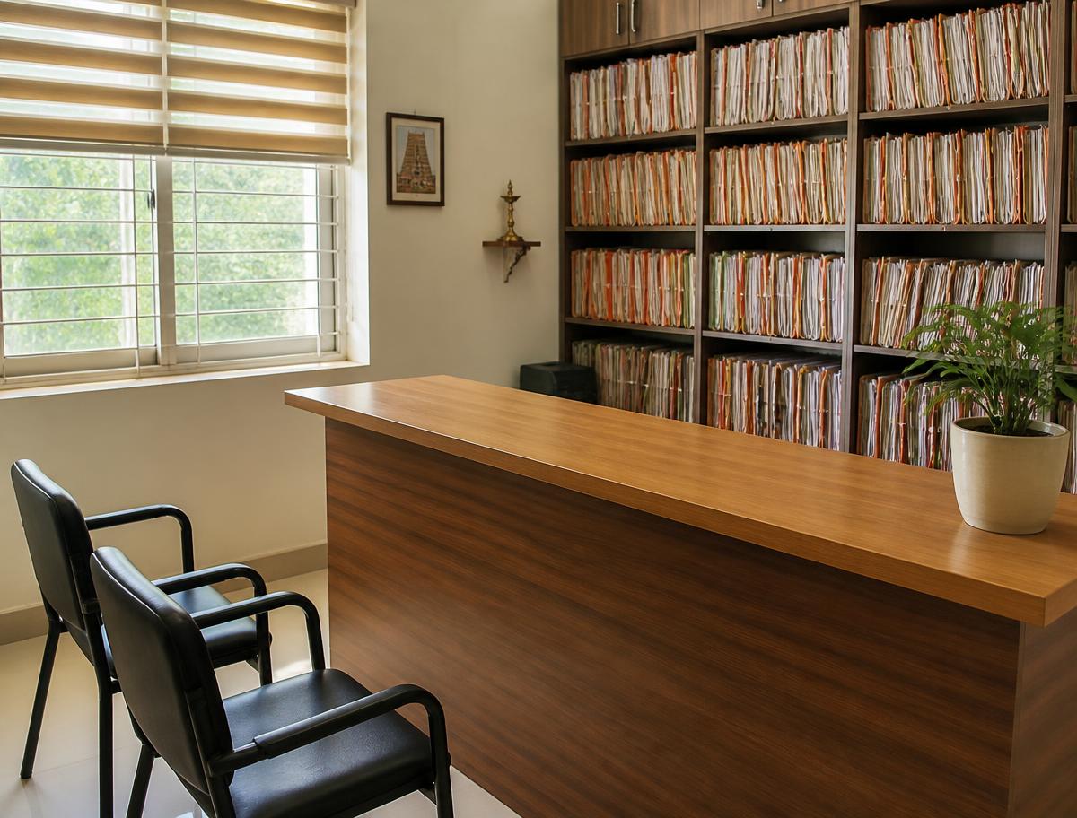 Interior of the documentation centre with a wooden counter and rows of client files